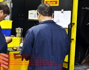 MIR machinists working at a CNC control station