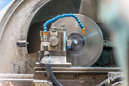 Lathe spindle turning in an industrial workshop