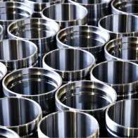 Array of machined parts with threaded bores at MIR Machining